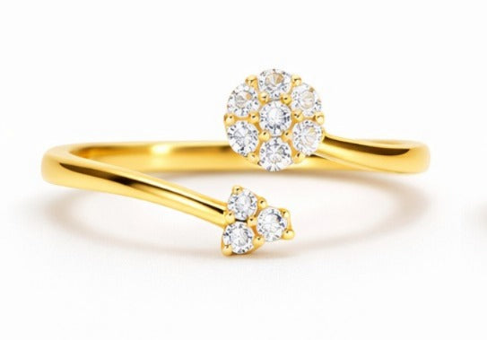 Gold ring with diamond accents on a white background